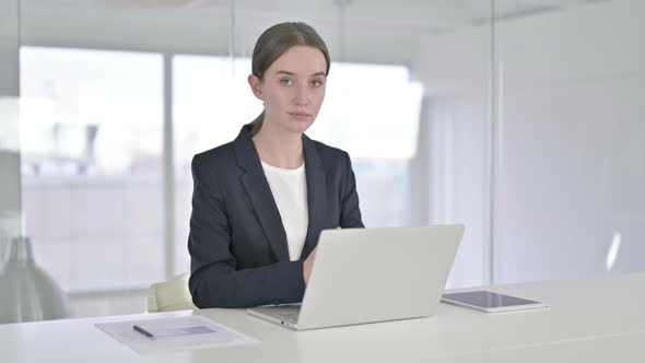 Young Businesswoman Looking at the Camera and Smiling