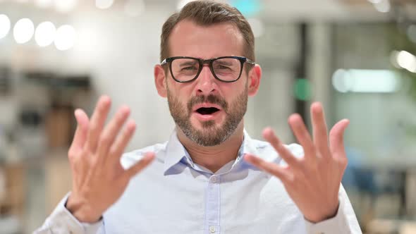 Portrait of Disappointed Businessman Reacting To Loss, Failure