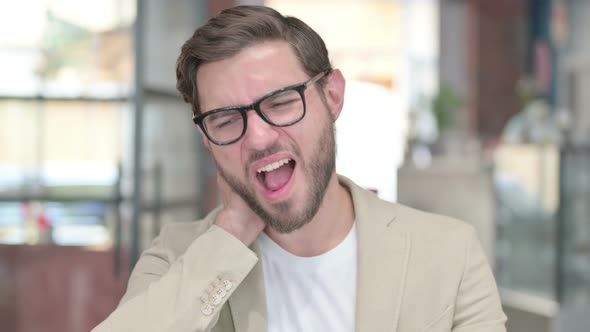 Attractive Young Man Having Neck Pain