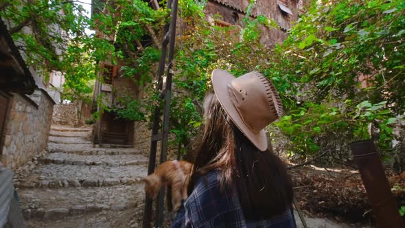 Woman Walking With Cat