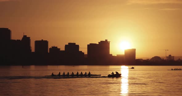 People rowing in the early hours during golden hour. Location in Perth, Western Australia.