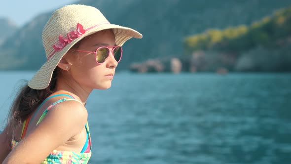 Young Girl Looking at Seascape From Yacht