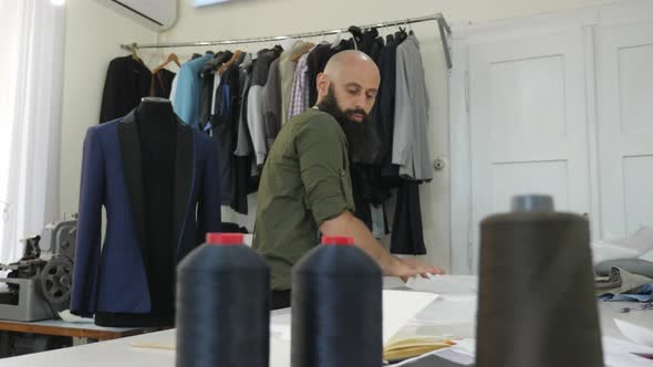 Tailor working with patterns