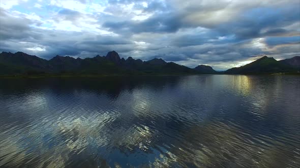 Slow flight above fjord waters on Vesteralen islands