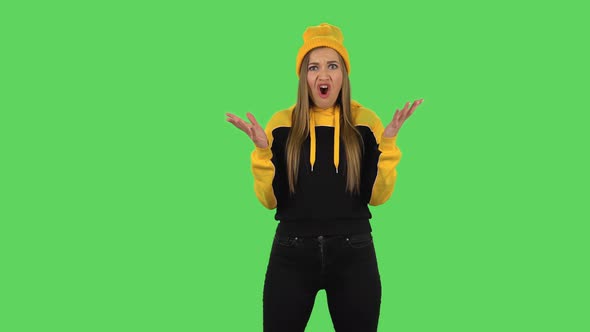 Modern Girl in Yellow Hat Very Upset and Screaming Oh My God. Green Screen