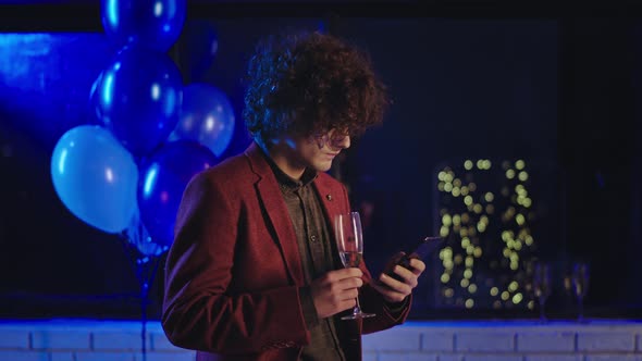 Good Looking Guy with Curly Hair at Birthday Party