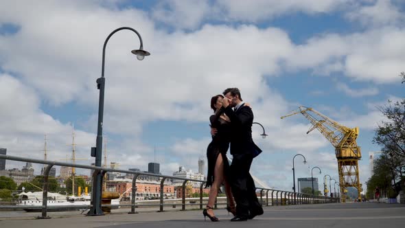 A tango dancer with his partner dancing in Puerto Madero, a touristic place in Buenos Aires