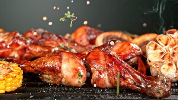 Super Slow Motion Shot of Seasoning Falling on Fresh Grilled Chicken Legs at 1000 Fps