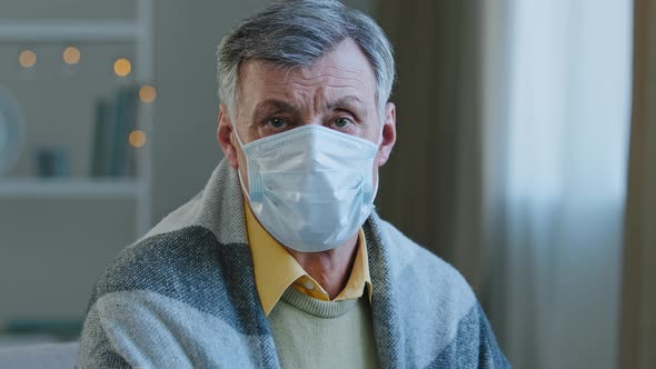 Closeup Adult Mature Man Wearing Medical Mask Looking at Camera Sick Old Male Sitting Indoors in