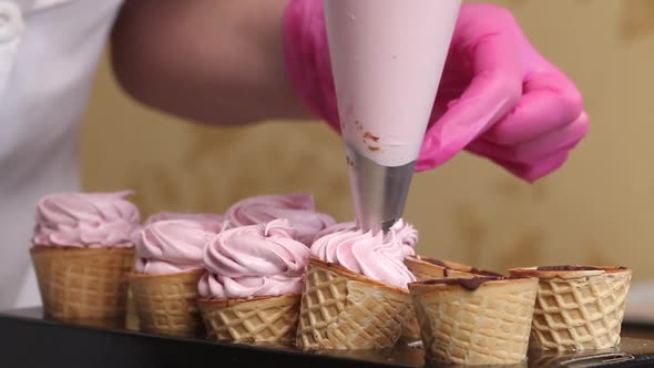 Wafer Cones Smeared Inside With Liquid Chocolate. They Are On Stands