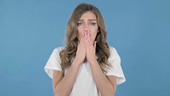 Shocked Surprised Young Girl Standing Isolated on Blue Background in Wonder