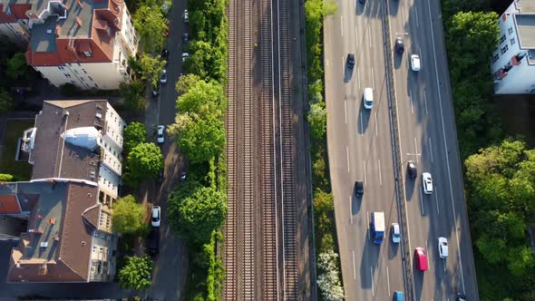 highway, train tracks, houses blocks.Spectacular aerial view flight bird's eye view tilt up drone f