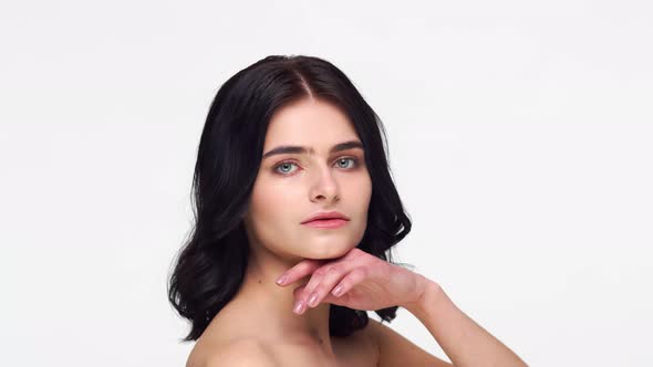 Studio portrait of young and beautiful brunette woman.