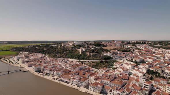 Sado river and Alcaçer do Sal charming cityscape, Portugal. Panoramic aerial view