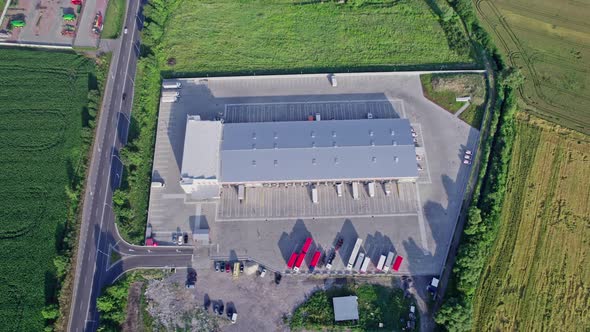 Buildings of Logistics Center Warehouses Near the Highway