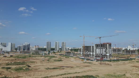 Construction site for a new city block. Construction work is underway.