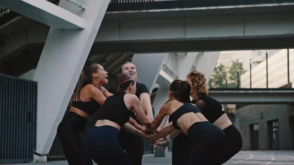 Group of Girls in Sports Uniforms Celebrate the Victory and Clap Their Hands