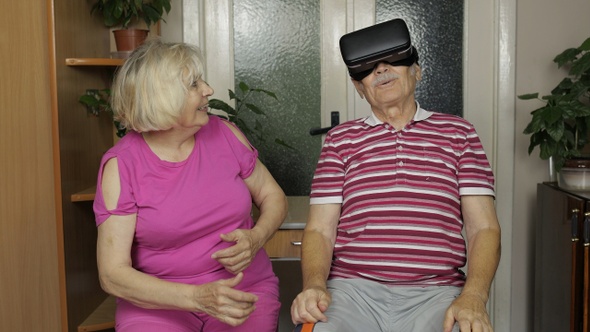 Grandfather and Grandmother with VR Headset Helmet Play Games, Watch Virtual Reality 3D 360 Video