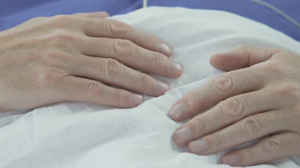 Hands of Elderly Man Lying on Stomach, Senior Male Sleeping, Having Rest in Bed