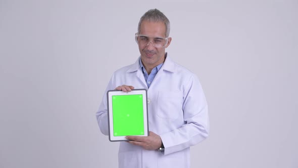 Happy Persian Man Scientist Showing Digital Tablet
