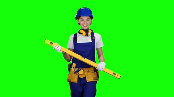 Girl Is Wearing a Yellow Building Level, Green Screen