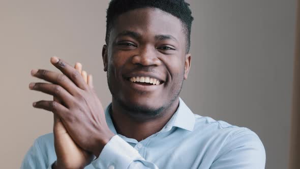 Amazed Young African Man Happy American Winner Employee Waving Clapping Hands Approve Looking at