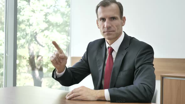 No Businessman Rejecting Offer By Waving Finger