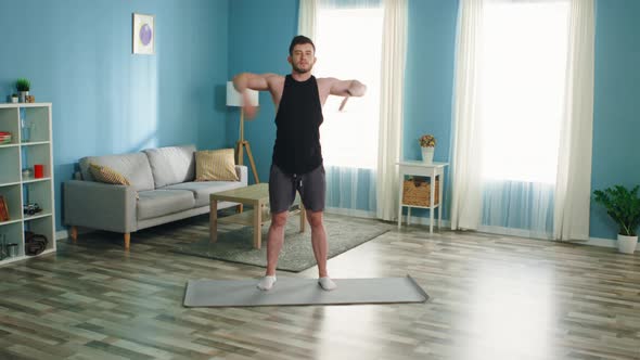 Strong Athlete Man Is Doing Arm Circles