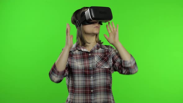 Young Woman Using VR Headset Helmet To Play Game. Watching Virtual Reality 3d 360 Video. Chroma Key