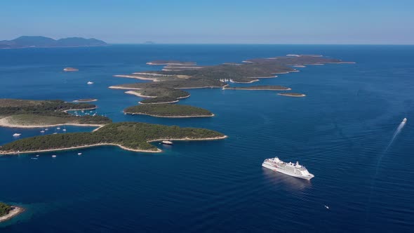 Aerial view on islands on sea and cruise liner. Blue water and islands with trees.