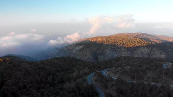 Rising aerial drone shot of Mount Olympus at sunrise