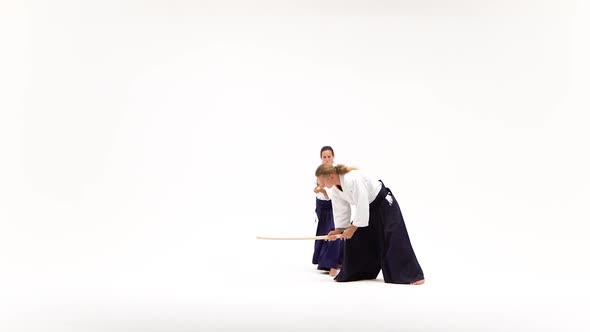 Male, Female in Kimono Practicing Aikido Techniques, Isolated on White