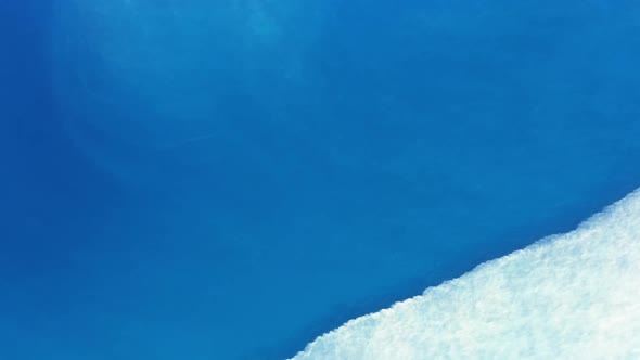 Aerial View of Calm Sea Water and White Foam