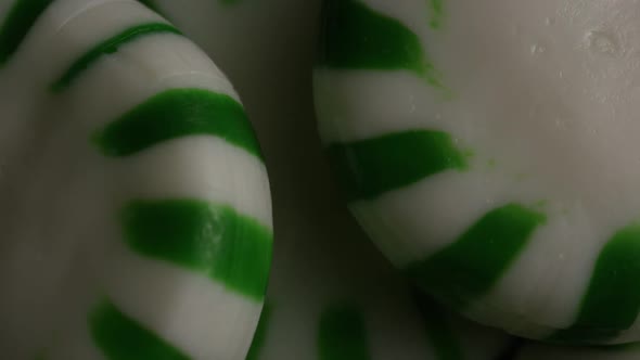 Rotating shot of spearmint hard candies - CANDY SPEARMINT 045