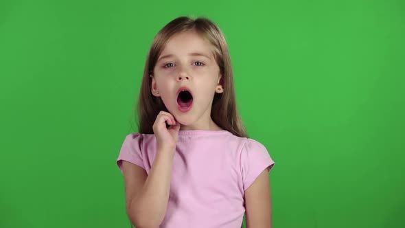 Little Girl Yawns. Green Screen. Slow Motion