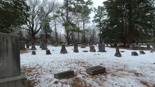 Drone Fly through Old Cemetery and tree in winter snow near Murfreesboro Tennessee