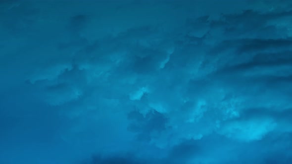 Timelapse of movement of dark blue night heavy clouds 4k footage alt