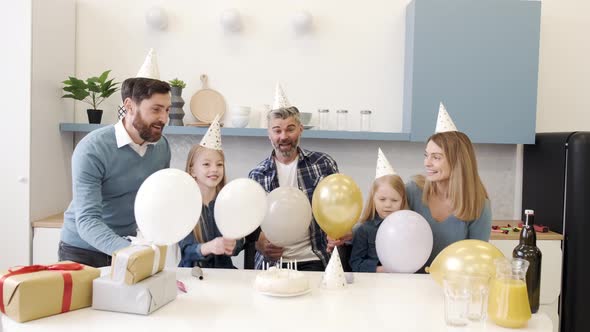 Multigeneration Family on a Indoor Birthday Party