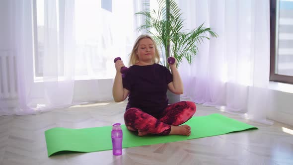 Fitness Training Blonde Overweight Woman Doing Fitness Exercises with Dumbbells Then Drinks Water