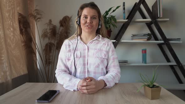 Business People with Headset Work in the Office to Support a Remote Client or Colleague