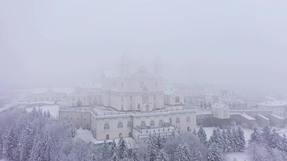 The Pochaev Lavra in the Fog at the Winter in Cloudy Day Aerial View
