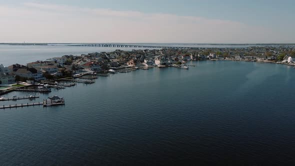 Aerial Shot of Neighborhood, Suburb. Flying Over the Pier with Boats Real Estate, Connecticut River