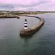 Drone Shot Circling Above Seaham Lighthouse and Pier in  Durham UK - VideoHive Item for Sale