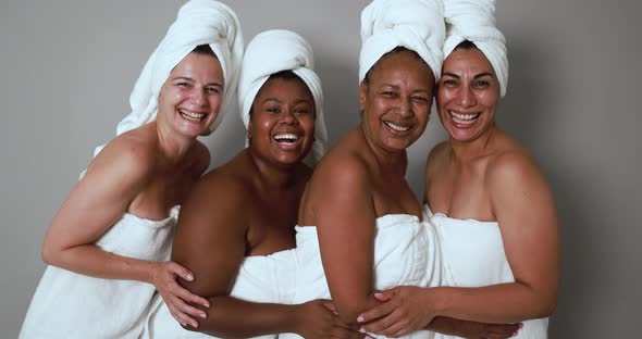 Multigenerational women having fun wearing face beauty mask - Skin care therapy and female power
