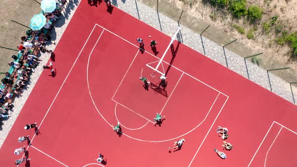 Aerial View of Young Athletes Playing Streetball on an Open Summer Court