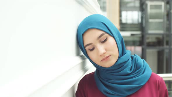 Portrait of Young Beautiful Muslim Girl in Traditional Dress Looking at Camera.