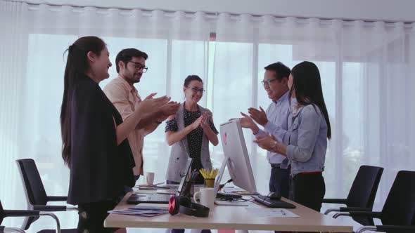 Successful Business People Celebrating Project Success at Office