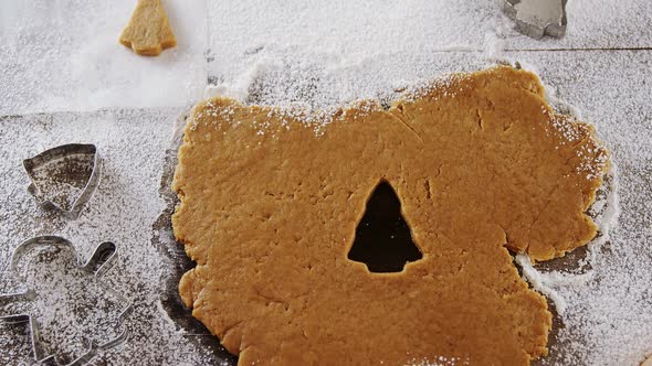 Cookies cutter being used to cut the dough