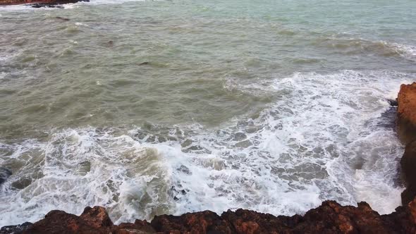 Ocean Wave Crashing Upon Rocks