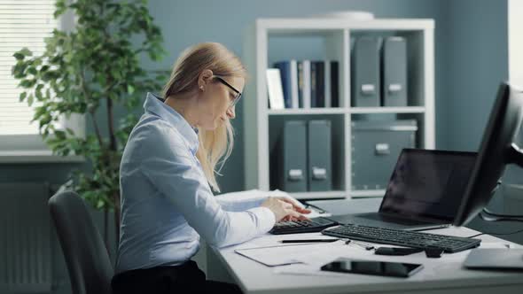 Woman Working Overtime at Office